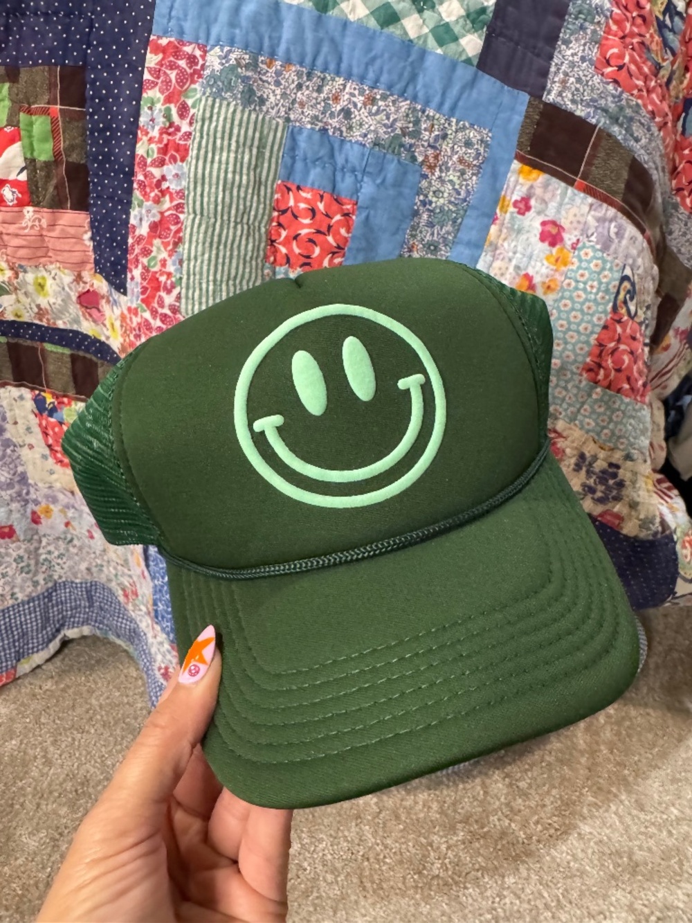 green smiley face trucker hat